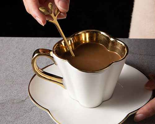White Ceramic Espresso Cup with Gold Trim